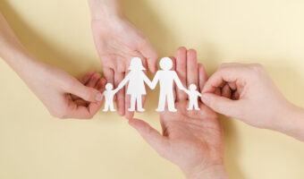 people-holding-together-hands-cute-paper-family