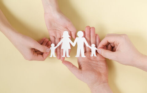 people-holding-together-hands-cute-paper-family