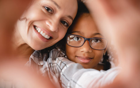 Mom and daughter taking making selfie photo together for social media online.Motherhood concept