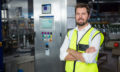 Portrait of confident male worker standing in factory