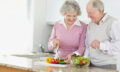 Senior couple preparing salad together. Image shot 2009. Exact date unknown.