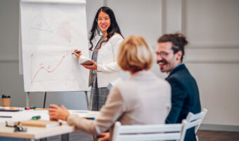 Asian businesswoman holding a presentation during a meeting in an office