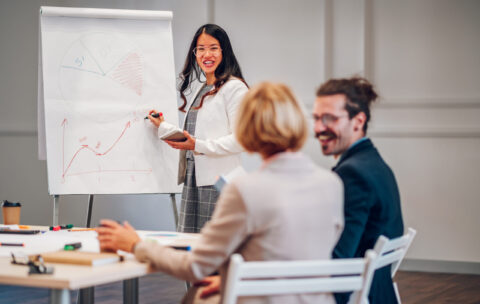 Asian businesswoman holding a presentation during a meeting in an office