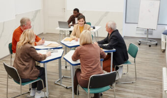 Group of students working in team at lesson