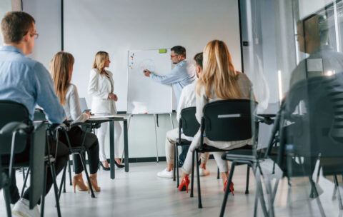 Teachers making master class. Group of professional business people is in the office