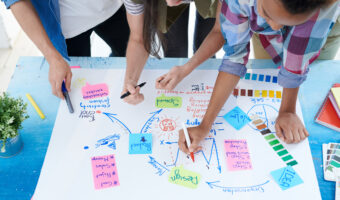 Young People Drawing Plan Above View