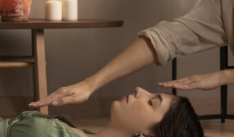 person-conducting-reiki-therapy
