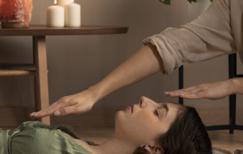 person-conducting-reiki-therapy