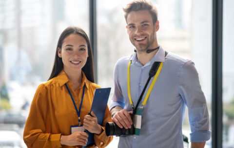 Two reporters feeling happy after a good working day