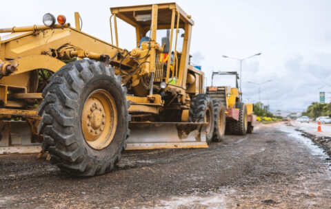 closeup excavators removing stone in the construction works of a