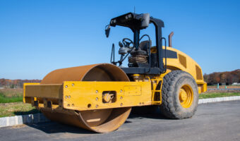 vibratory compactor during road and highway construction industrial roadworks with heavy duty machinery