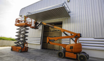 Workers working on the construction site of the new factory indu
