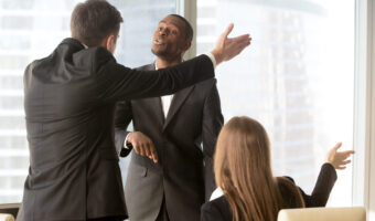 Annoyed business partners arguing during meeting