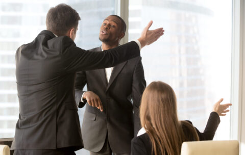 Annoyed business partners arguing during meeting