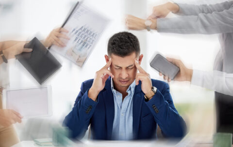 hands-with-paperwork-headache-stressed-businessman-working-with-problem-bad-mental-health-blurry-migraine-anxiety-frustrated-worker-overworked-tired-exhausted-with-documents-deadlines (1)