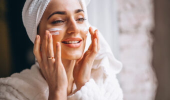 Woman applying face cream