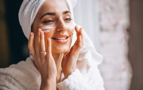 Woman applying face cream